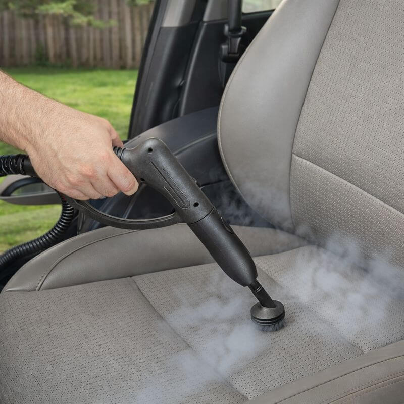 Wagner Spraytech 905e steam cleaner sanitizing a car seat using chemical-free steam