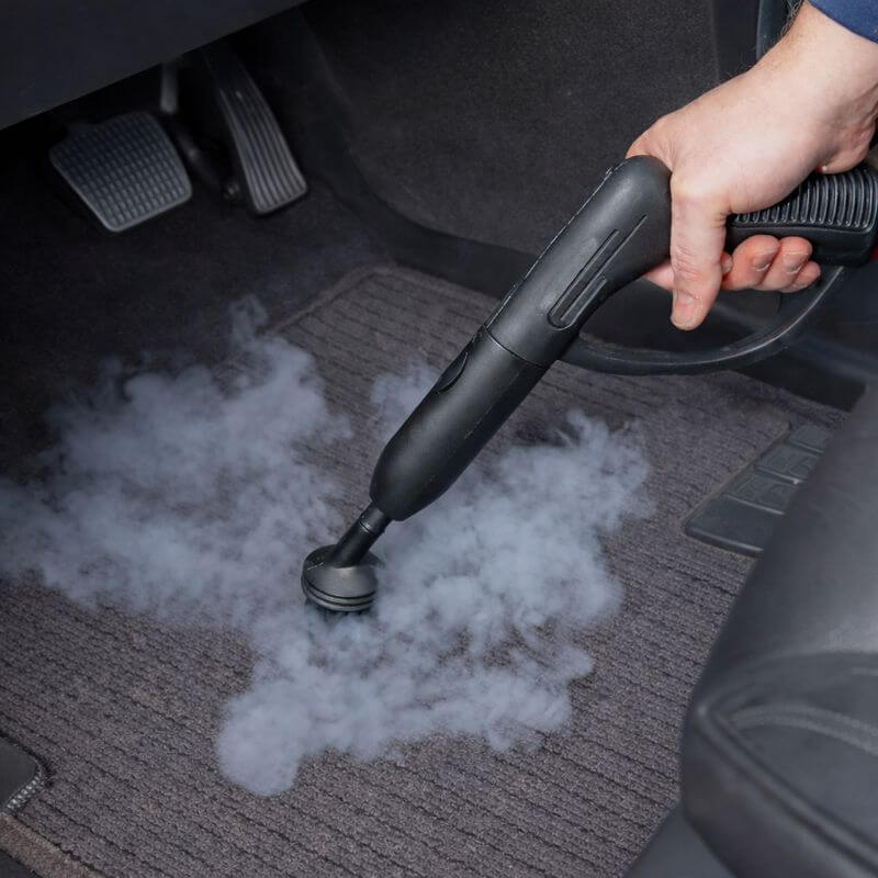 Wagner Spraytech 905e steam cleaner delivering continuous steam to clean car carpet