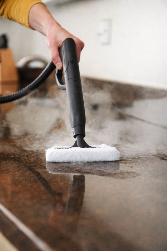Wagner Spraytech 905e delivering consistent high-temperature steam to clean a kitchen countertop