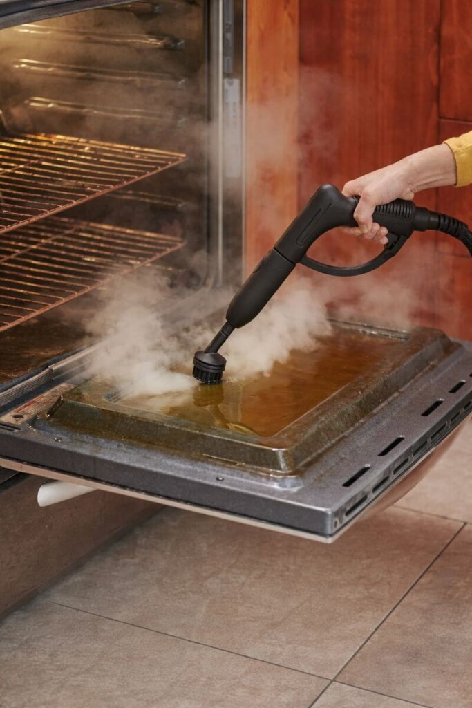 Wagner Spraytech 905e using a narrow attachment to direct steam onto oven grime