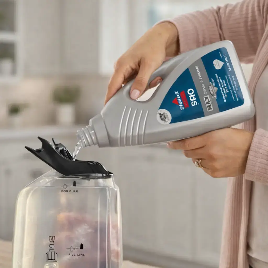 Filling the solution tank on Bissell Revolution HydroSteam Pet 3432 carpet cleaner.